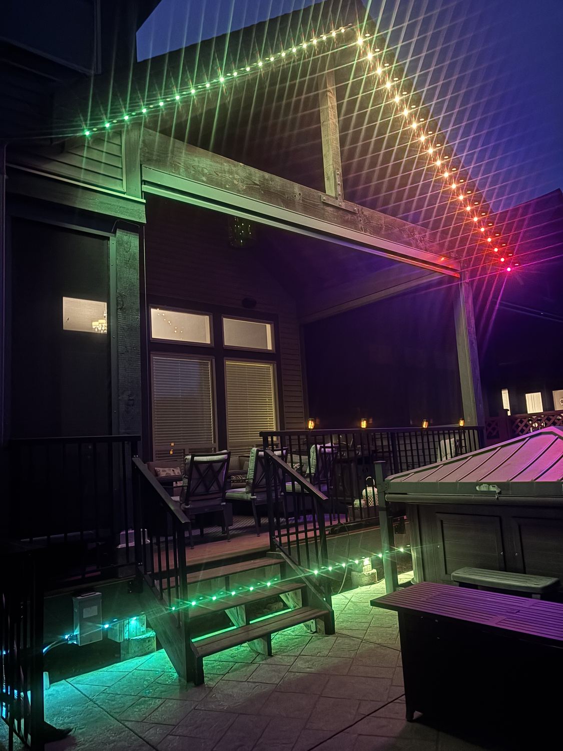 Real Delta Exterior permanent LED lighting install glowing on a backyard patio