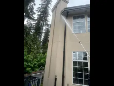 Delta Exterior technician at work on a home in the Lower Mainland